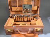 a suitcase with a lot of bottles inside of it
