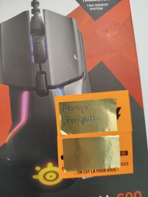 a picture of a computer mouse with a sticker on it