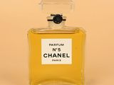 a bottle of chanel perfume sitting on top of a table