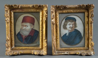 two framed portraits of a man and a woman in red hats