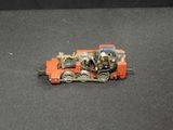 a toy train that is sitting on a black surface