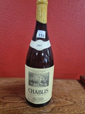 a bottle of wine that is sitting on a table