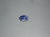 a picture of a badge on the floor of a room