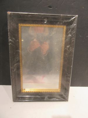 a picture of a picture of a person in a picture frame on a table