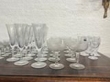 a lot of wine glasses sitting on a table