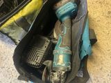 a bag with tools inside of it on the floor