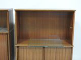 pair of mid century walnut bookcases with glass shelves