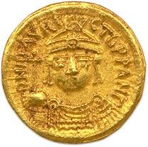 une pièce d'or sur laquelle est représenté le visage d'un homme