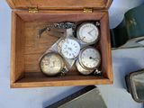 many different types of watches in a wooden box