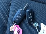 two car keys that are sitting next to each other