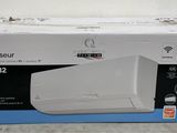 the box of a white air conditioner sitting on top of a counter