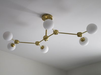 a chandelier that has five white glass balls on it