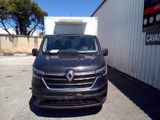 the grey van is parked in front of a white building