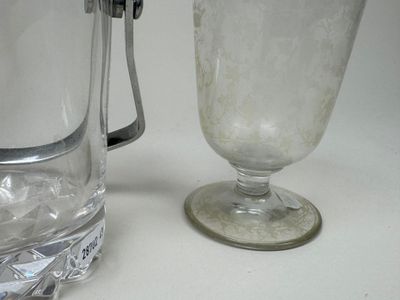 a pitcher and a glass of water on a table