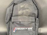 a grey backpack with a red, white, and blue logo on it