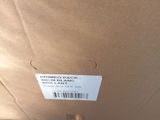 a box that has a label on it and a person standing underneath it