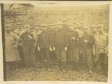 photograph of a group of men in military uniforms posing for a picture
