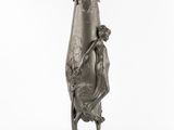 an image of a bronze vase with a woman holding a baby