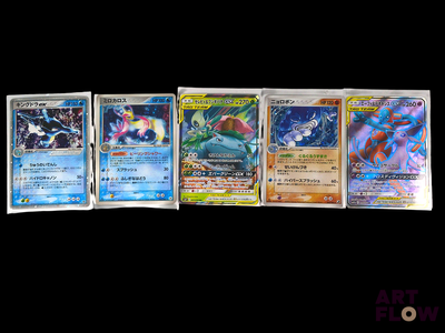 several pokemon cards are lined up in a row on a black background