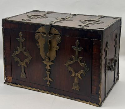 a small wooden box with metal decorations on it