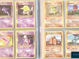 several pokemon cards are displayed on a table in front of each other
