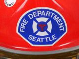 a fire department badge on the back of a fire hydrant