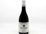 a bottle of wine that is sitting on a table