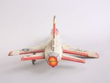 a toy airplane that is sitting on a white surface
