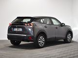 the rear end of a gray toyota c - hr parked on a checkered floor
