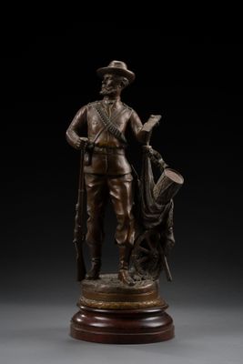 a bronze statue of a man with a dog on a pedestal