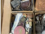 boxes filled with assorted items including a teddy bear and other items