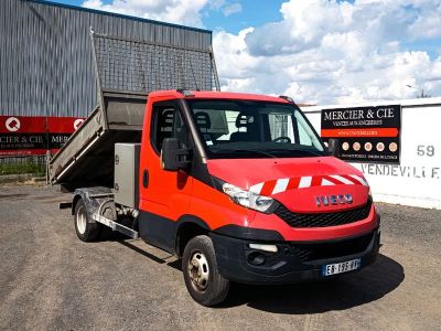 a red truck that is parked in front of a building