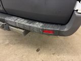 a close up of the rear bumper of a gray truck
