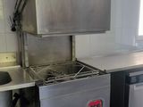 a kitchen with a stove, dishwasher, and dishwasher in it