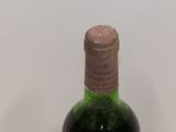 a bottle of wine that is sitting on a table