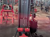 a gym with a lot of machines in the room