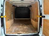 a white van with a wooden floor in the back of it