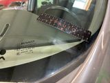 a measuring tape on the windshield of a car