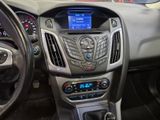 the interior of a car with a steering wheel and dashboard controls