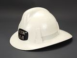 an image of a white hard hat with a sticker on it