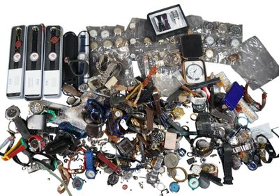 a pile of assorted items that are on a white surface