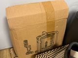 a shoe box and a pair of shoes on the floor