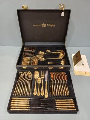 a black case with silverware in it on a table