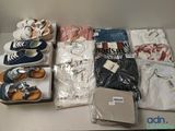 many pairs of shoes that are on a table