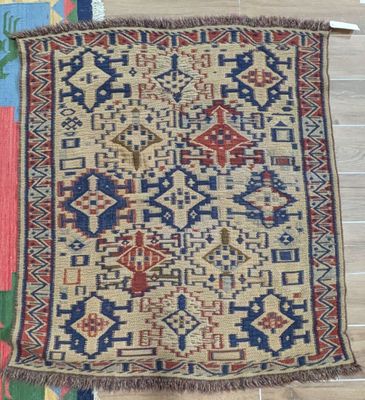 a rug on a wooden floor with a wooden floor and wooden flooring