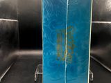 a blue box with a gold logo on it sitting on a table