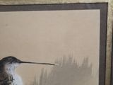 a picture of a bird that is sitting on a table