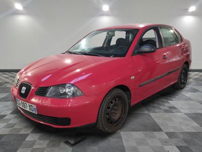 a picture of a bright red car parked in a garage