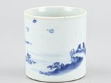 an image of a blue and white cup with a landscape on it