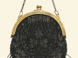 black beaded purse with gold trim and fringes